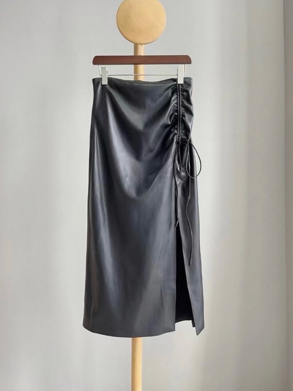 Nanushka Classic Black Faux Leather Midi Skirt with Side Ruched Detail